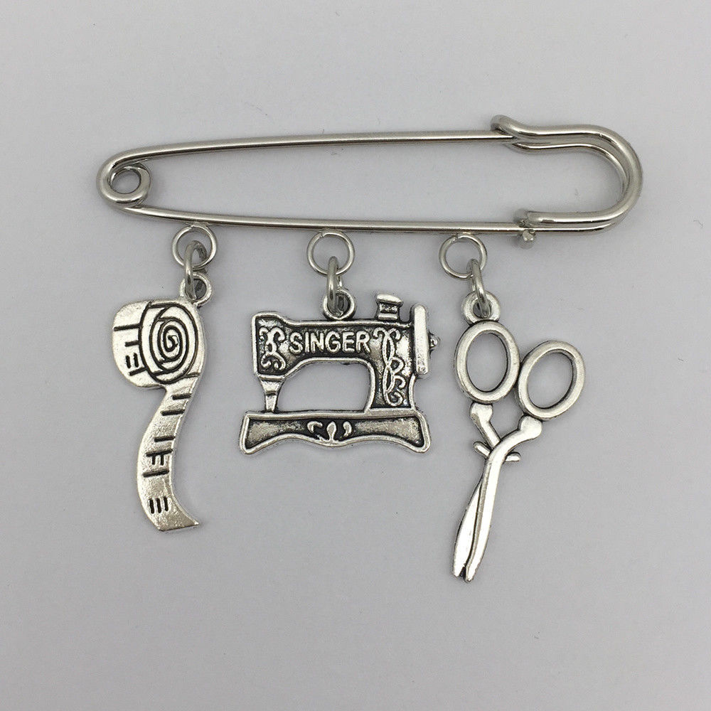 Seamstress pin with charms